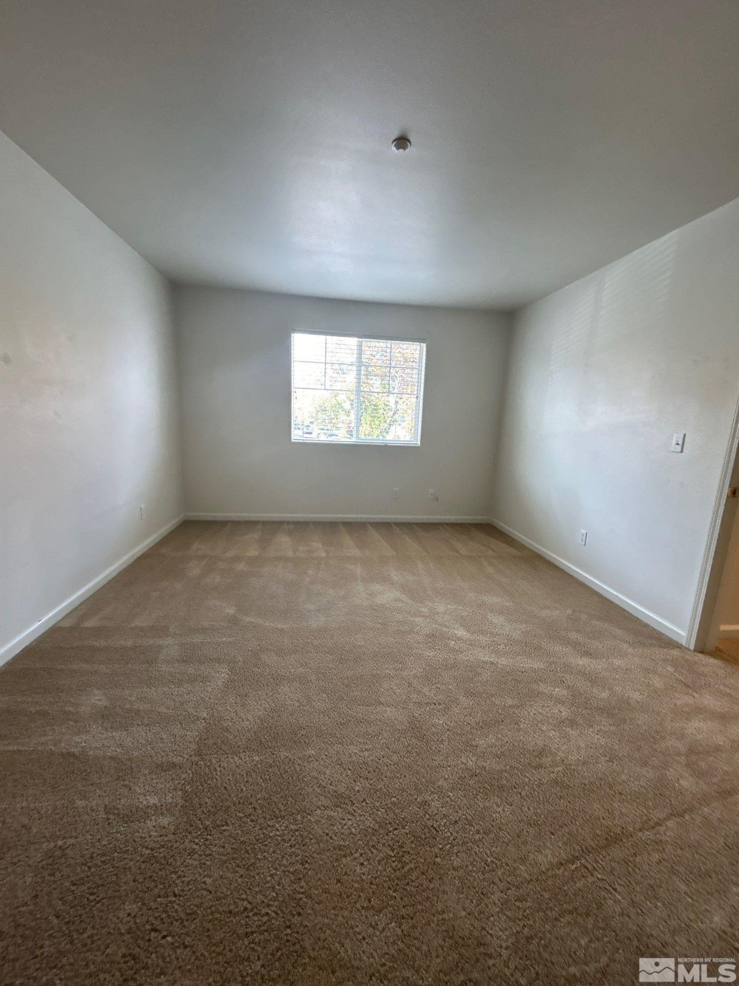405 Holcomb Avenue Reno, NV 89502 - Photo 2 of 17 an empty room with windows