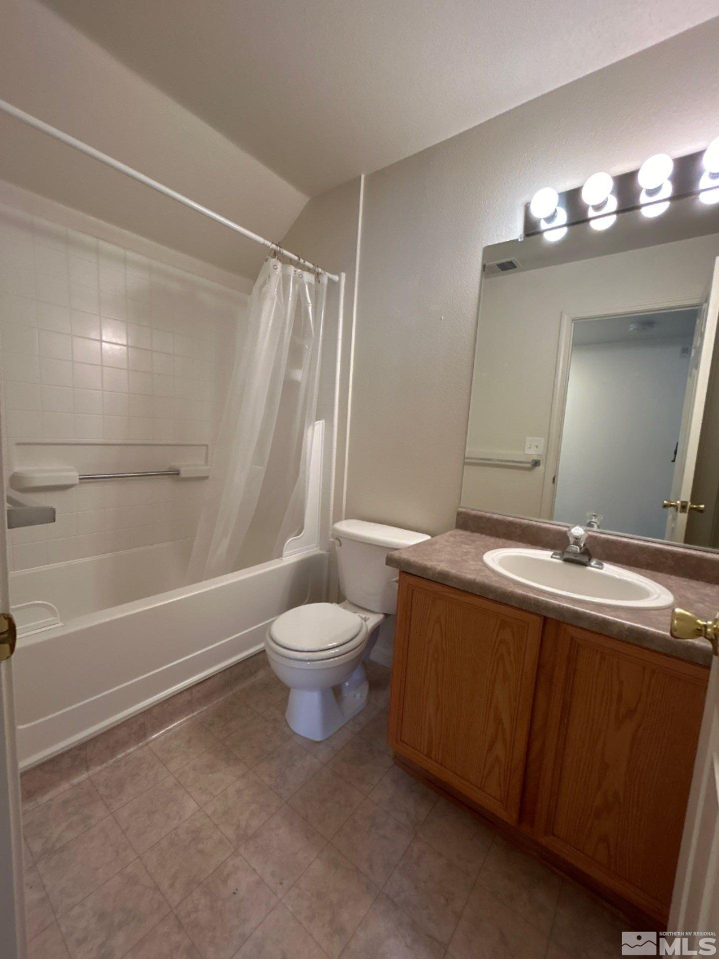 405 Holcomb Avenue Reno, NV 89502 - Photo 3 of 17 a bathroom with a sink a toilet and shower