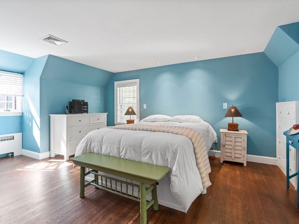 41 Sawyer Road Wellesley, MA 02481 - Photo 13 of 28 a bedroom with a bed and wooden floor
