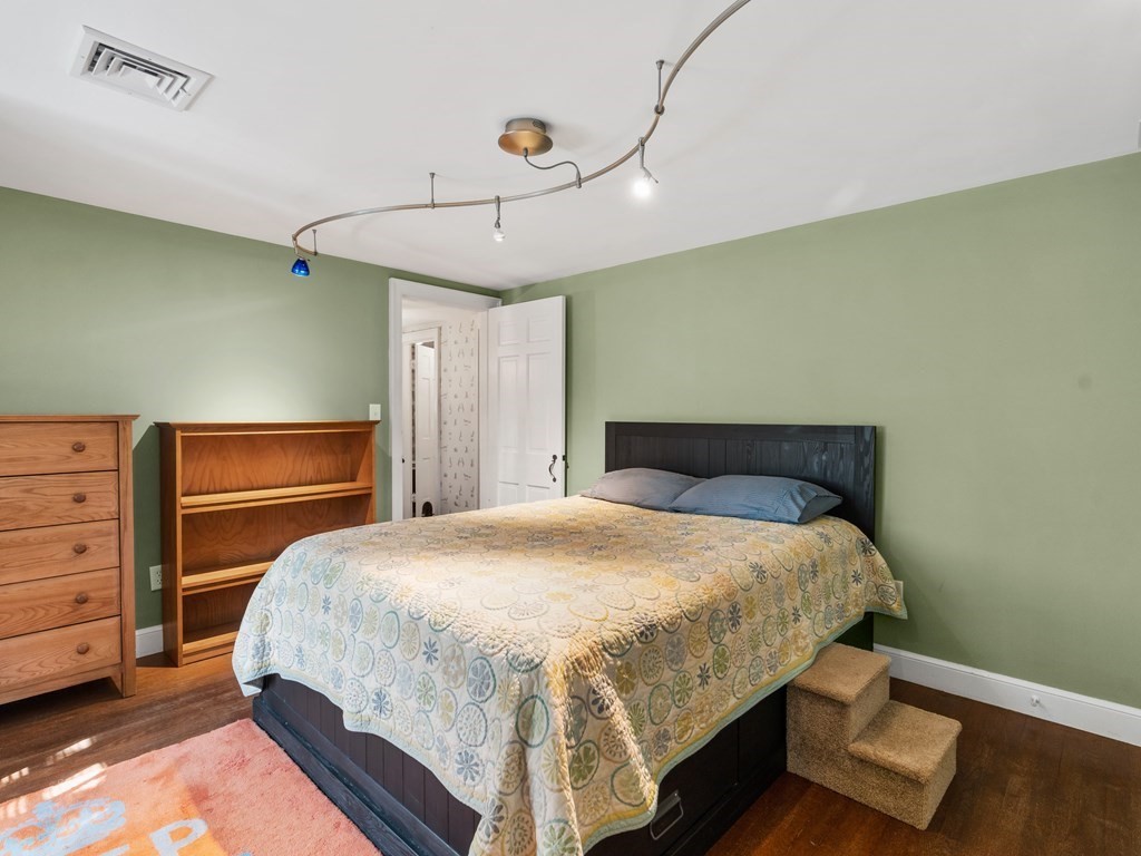 41 Sawyer Road Wellesley, MA 02481 - Photo 17 of 28 a bedroom with a bed and cabinet