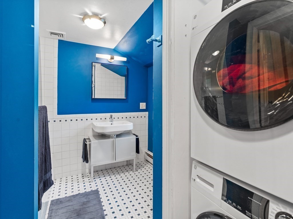 41 Sawyer Road Wellesley, MA 02481 - Photo 20 of 28 a bathroom with a sink and mirror