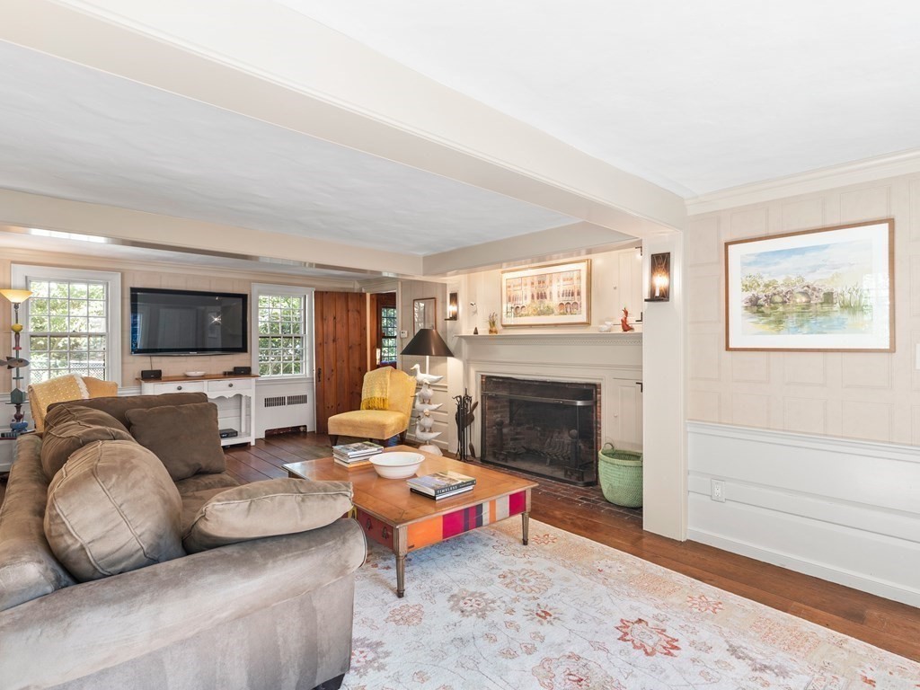 41 Sawyer Road Wellesley, MA 02481 - Photo 3 of 28 a living room with furniture flat screen tv and a fireplace