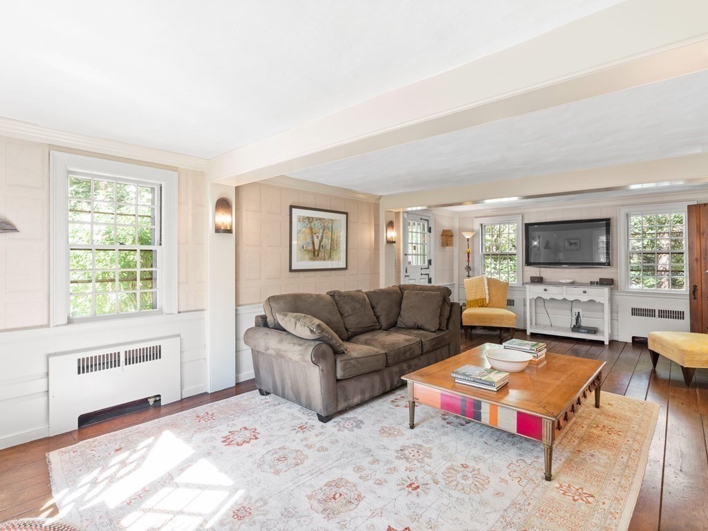 41 Sawyer Road Wellesley, MA 02481 - Photo 4 of 28 a living room with furniture and a flat screen tv