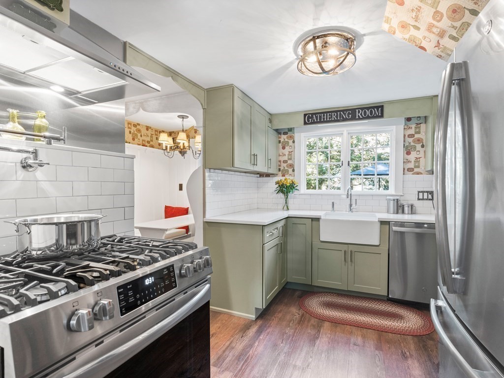 41 Sawyer Road Wellesley, MA 02481 - Photo 6 of 28 a kitchen with a stove and a sink