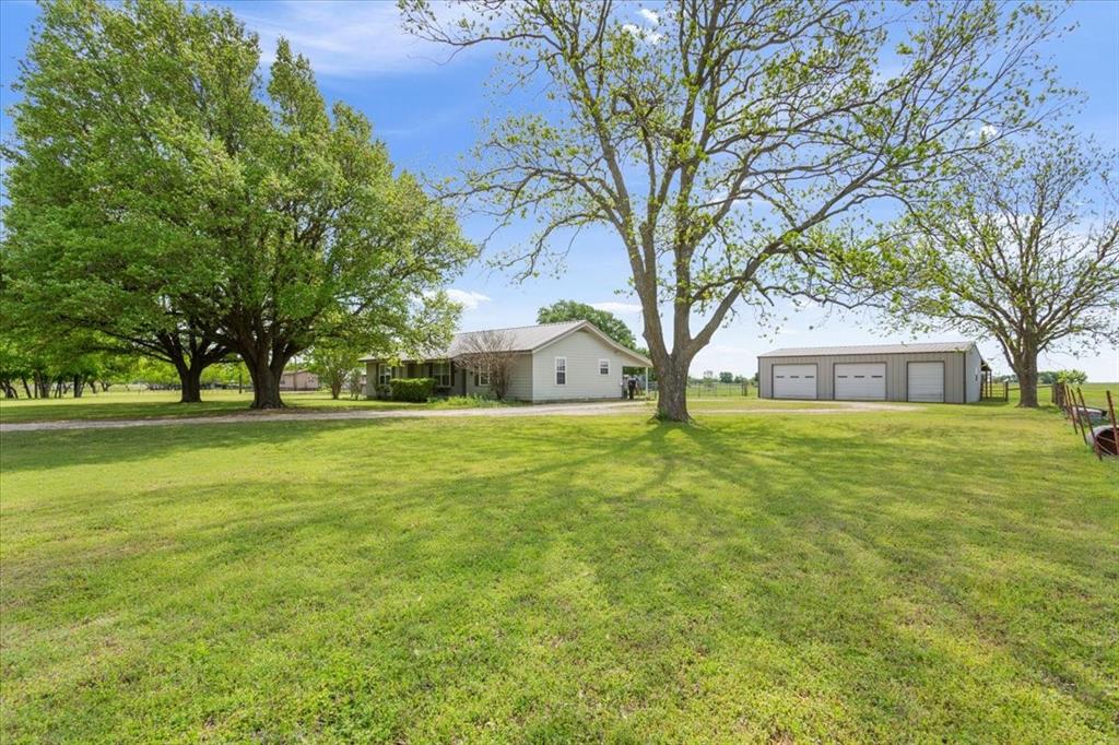 2936 Bode Road West, TX 76691 - Photo 1 of 29 a front view of house with yard and green space