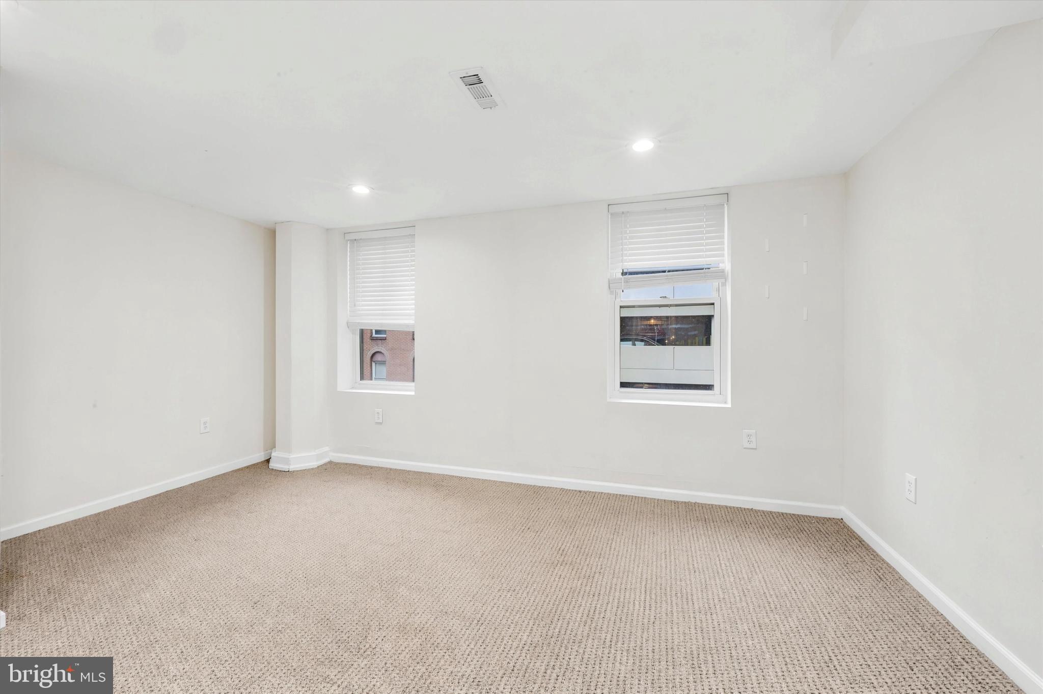 33 South 19th Street Philadelphia, PA 19103 - Photo 12 of 15 an empty room with a empty space and windows