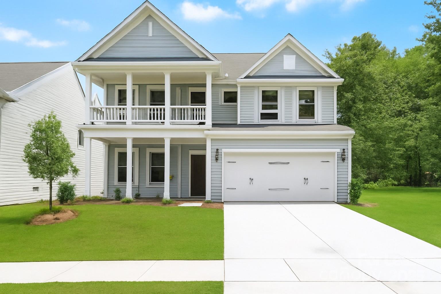 5409 Verona Road Charlotte, NC 28213 - Photo 1 of 20 a view of a white house with a small yard and potted plants
