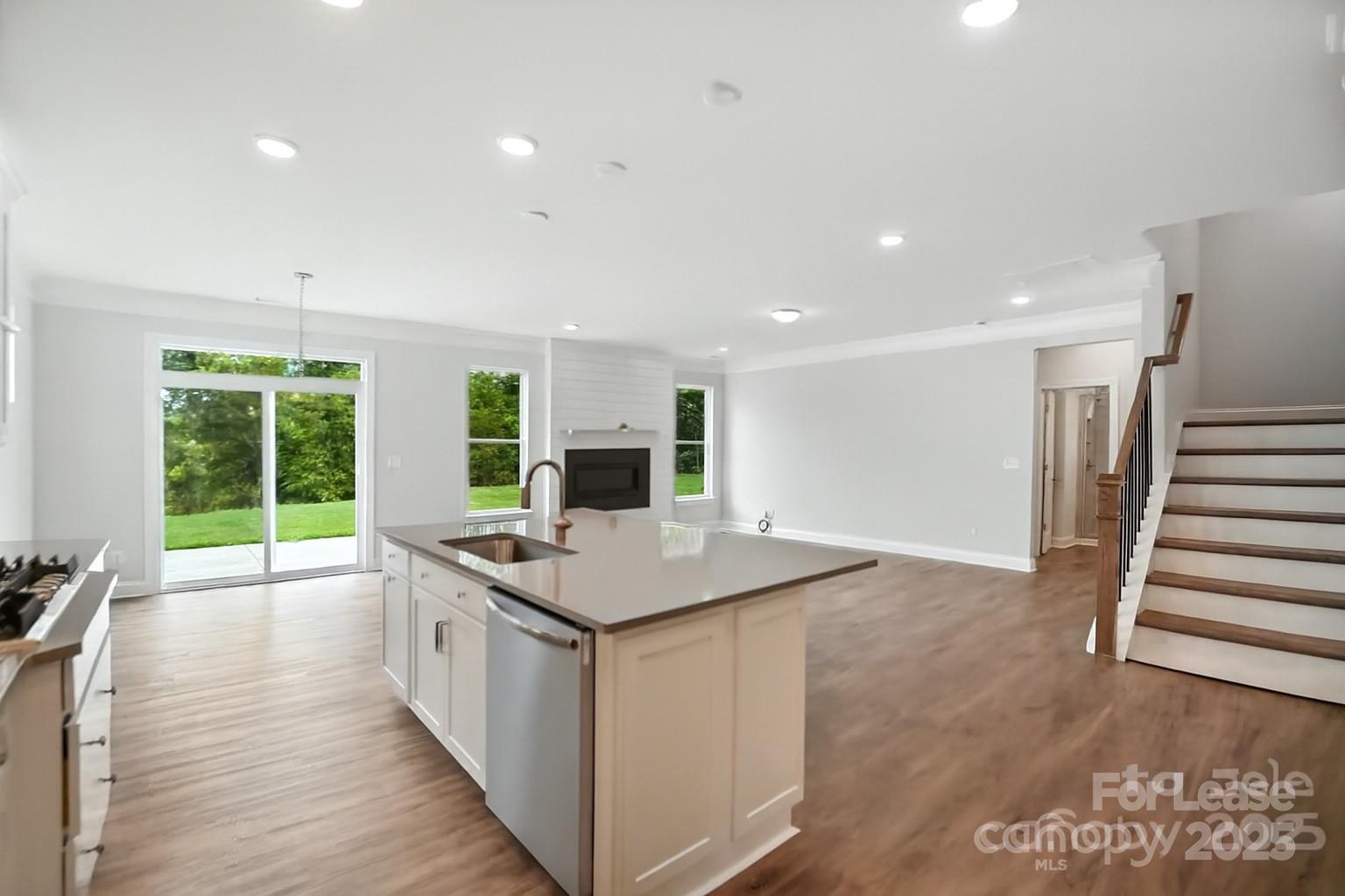 5409 Verona Road Charlotte, NC 28213 - Photo 2 of 20 a kitchen with stainless steel appliances granite countertop a stove and a sink