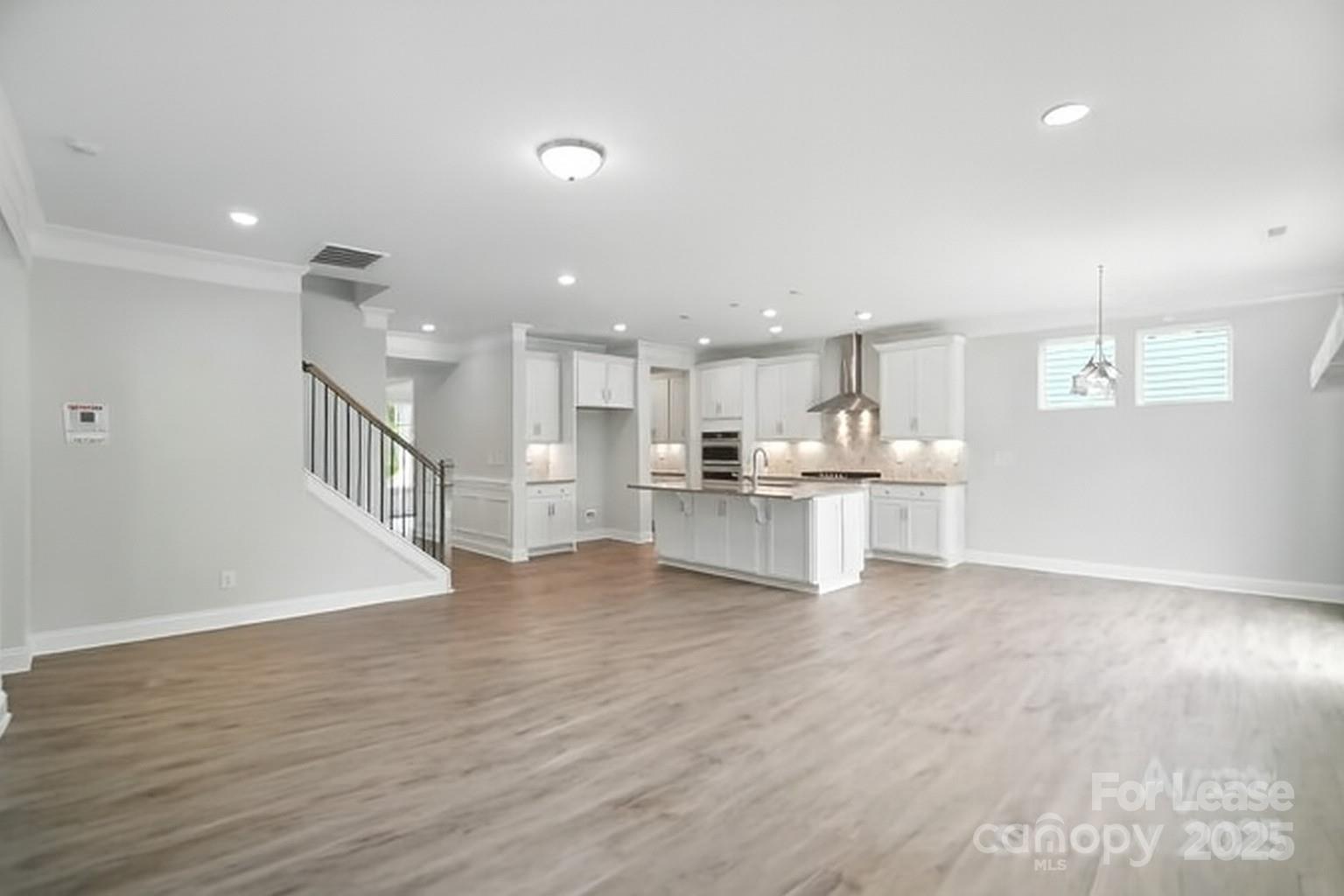 5409 Verona Road Charlotte, NC 28213 - Photo 3 of 20 a view of kitchen dining table chairs microwave and cabinets