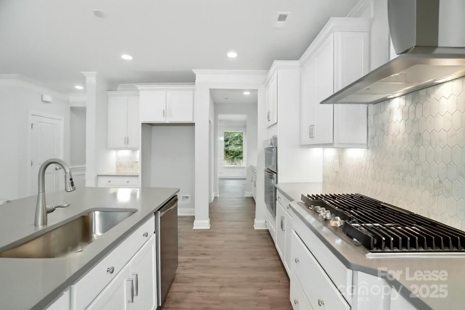 5409 Verona Road Charlotte, NC 28213 - Photo 5 of 20 a kitchen with kitchen island granite countertop a sink stainless steel appliances and cabinets