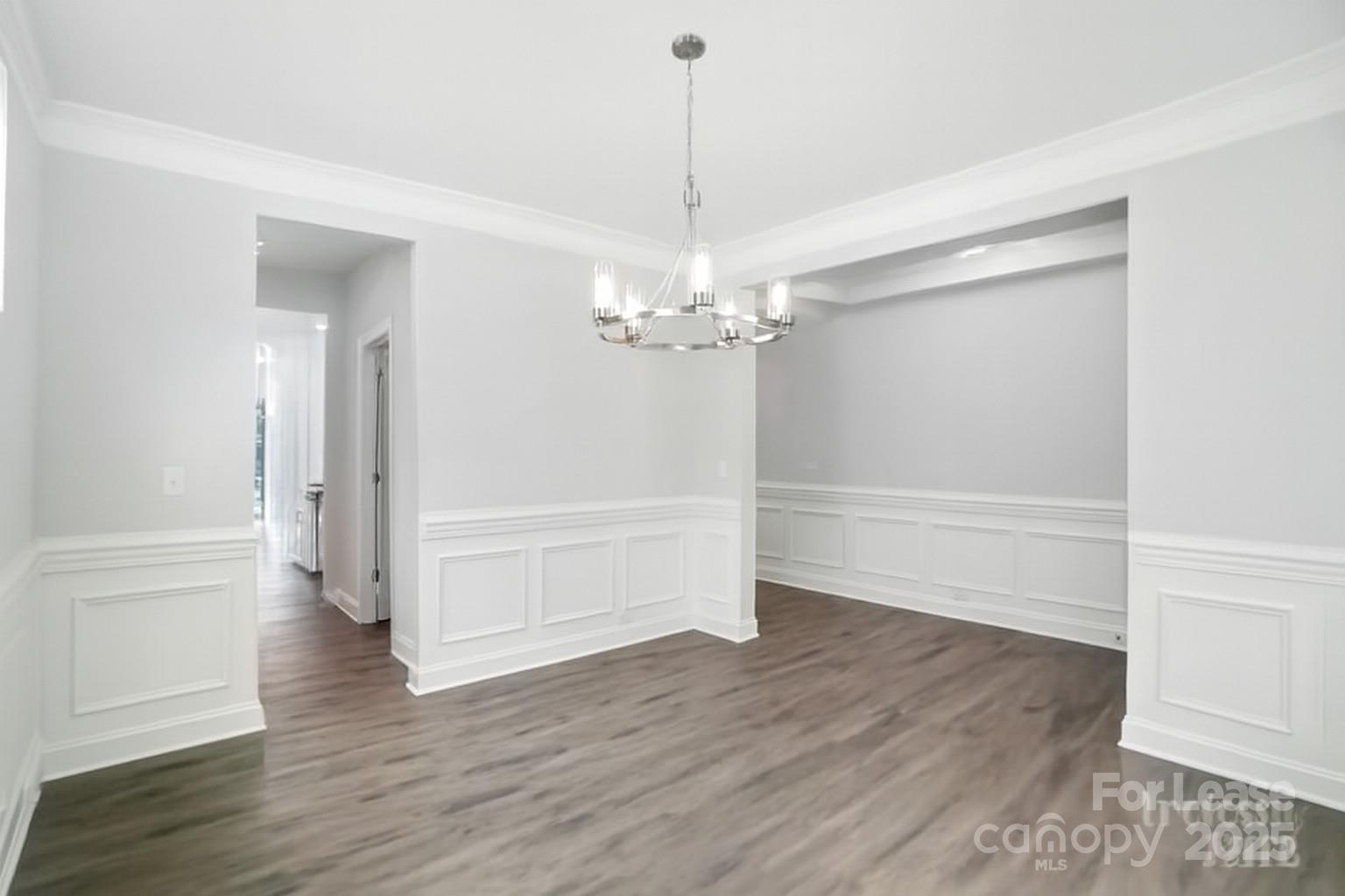 5409 Verona Road Charlotte, NC 28213 - Photo 10 of 20 a view of a room with wooden floor and ceiling fan
