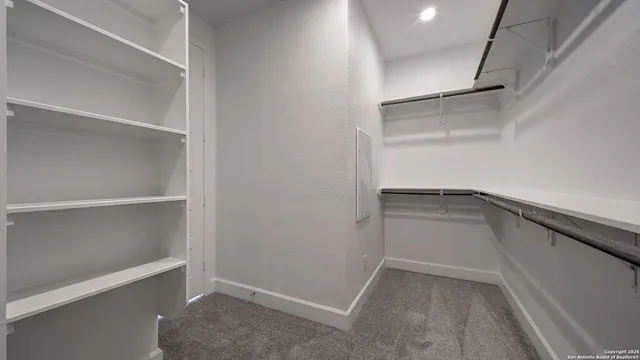 a view of an empty walk in closet