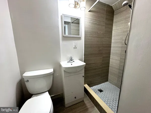 a bathroom with a toilet and a sink