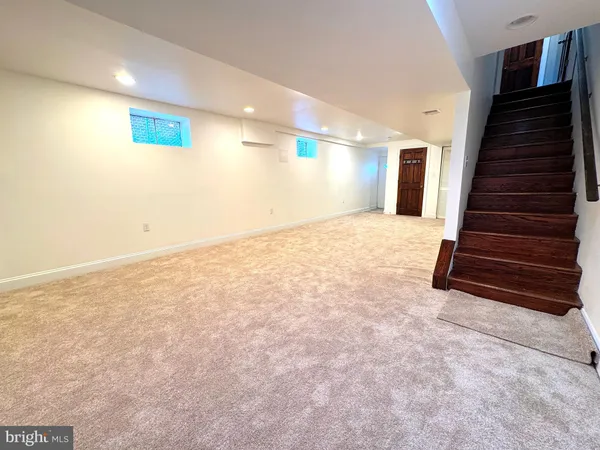 a view of an empty room with stairs