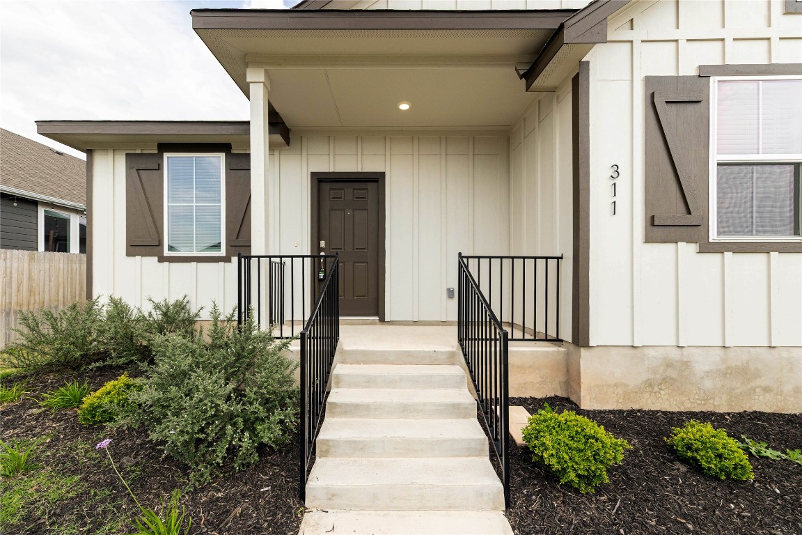 311 Ravens Crest Drive Hutto, TX 78634 - Photo 1 of 1 a front view of a house with a yard