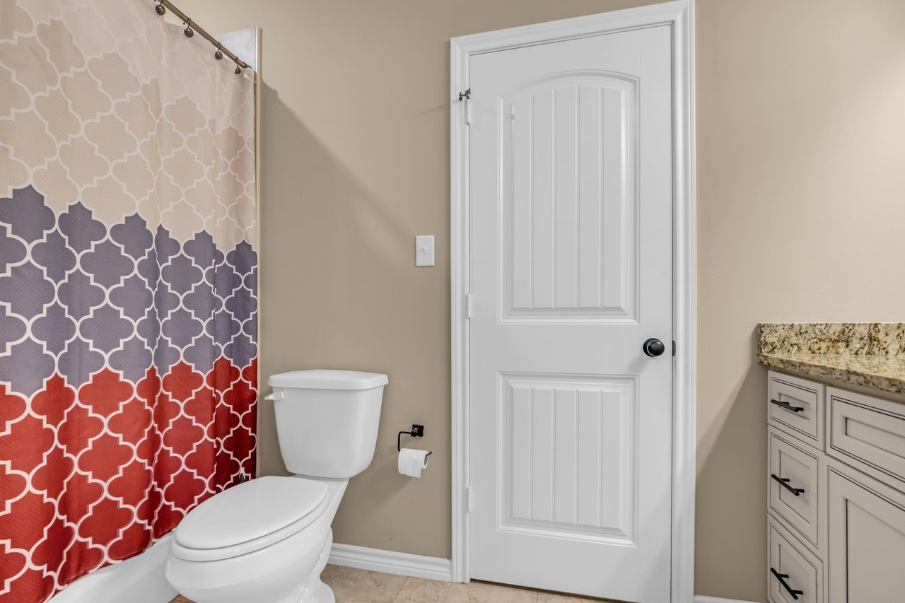 4 Firewood Road Huntsville, TX 77340 - Photo 24 of 36 Primary Bathroom and the Primary Closet is behind that door