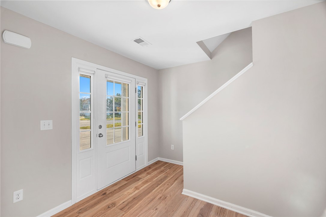 119 Sunny Point Loop Central, SC 29630 - Photo 6 of 33 Warm wood flooring and an abundance of natural light welcome visitors inside the front entry.