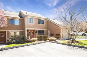 Welcome Home, a rare corner unit with plenty of light and a garage.