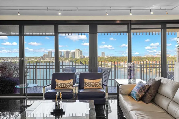 a large kitchen with stainless steel appliances granite countertop a lot of counter space and a sink