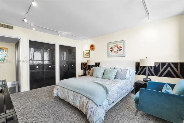 a white toilet sitting next to a shower