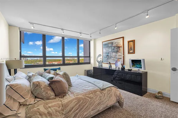 a living room with lots of furniture and a view of dining room