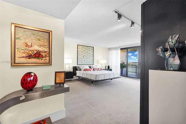 a swimming pool with a couches and palm trees