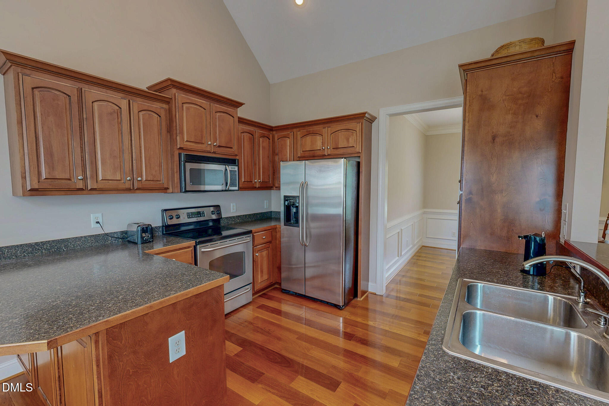 115 Duncan Plantation Road Timberlake, NC 27583 - Photo 29 of 48 a kitchen with stainless steel appliances granite countertop a refrigerator stove and sink