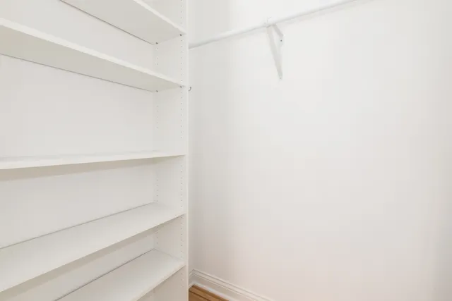 a view of an empty walk in closet