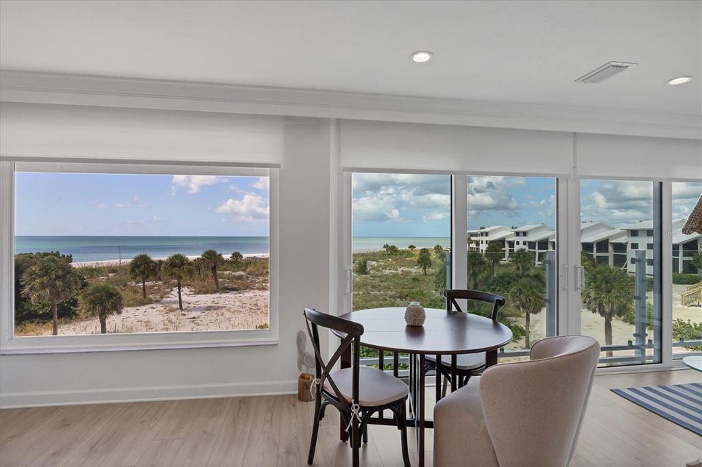 5000 Gasparilla Road, Unit 304 Boca Grande, FL 33921 - Photo 12 of 30 a view of a dining room with furniture window and outside view