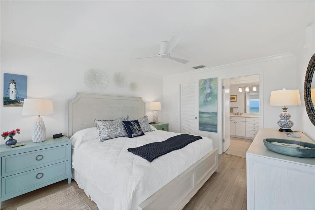 5000 Gasparilla Road, Unit 304 Boca Grande, FL 33921 - Photo 18 of 30 a bedroom with a bed and a dresser