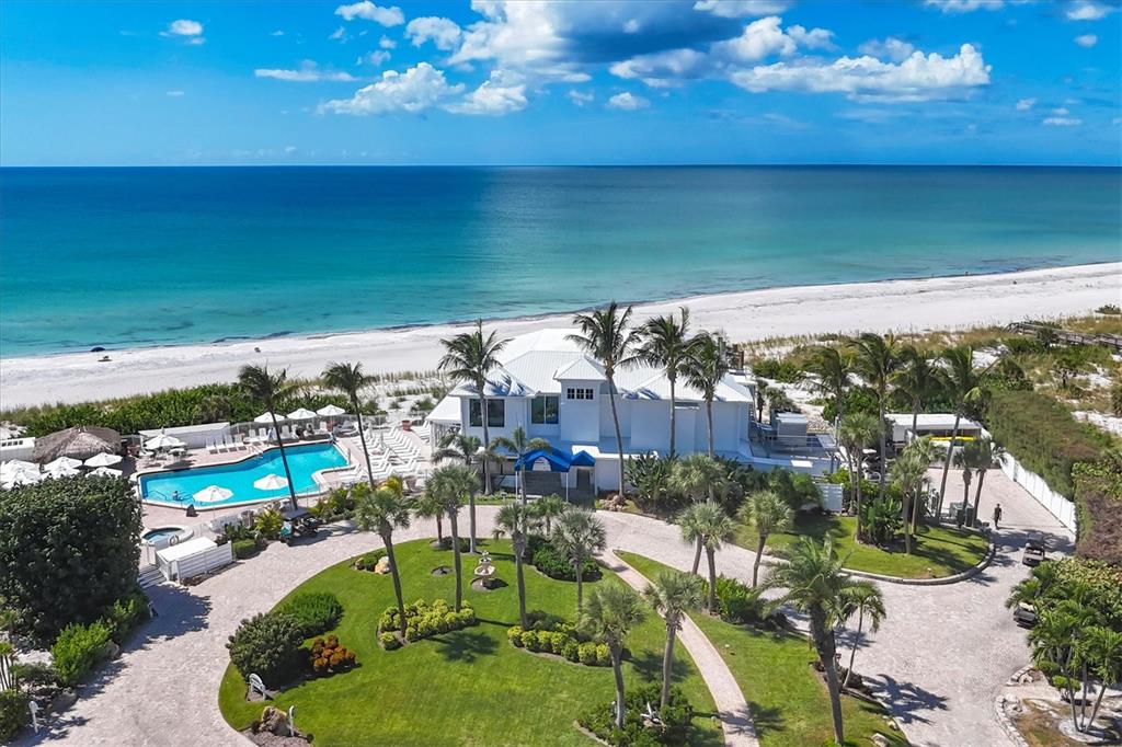 5000 Gasparilla Road, Unit 304 Boca Grande, FL 33921 - Photo 23 of 30 a view of a lake with a yard