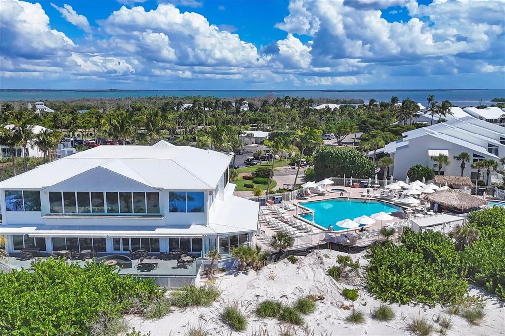5000 Gasparilla Road, Unit 304 Boca Grande, FL 33921 - Photo 24 of 30 a view of a house with a yard and sitting area