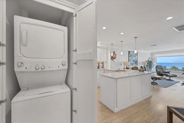 a view of washer and dryer with wooden floor