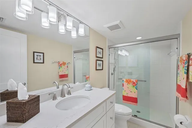 a bathroom with a sink a bath tub and a mirror