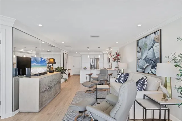 a living room with fireplace furniture and a flat screen tv
