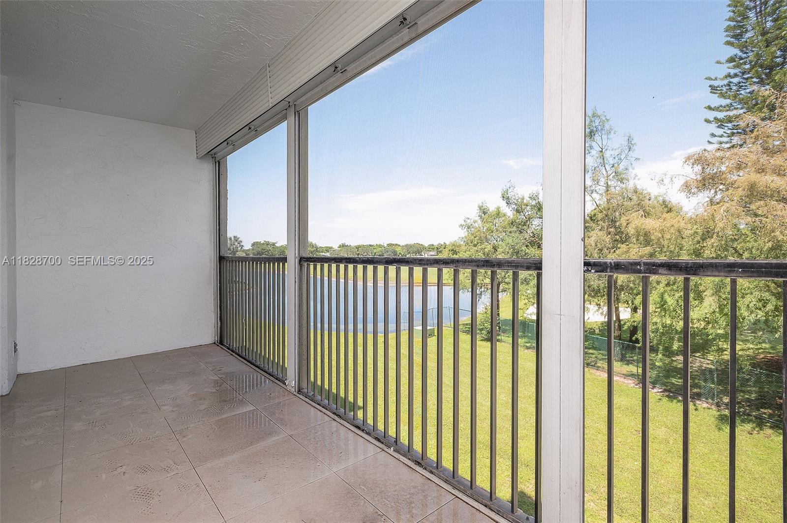 3150 West Rolling Hills Circle, Unit 307 Davie, FL 33328 - Photo 13 of 20 a view of a glass door and wooden floor