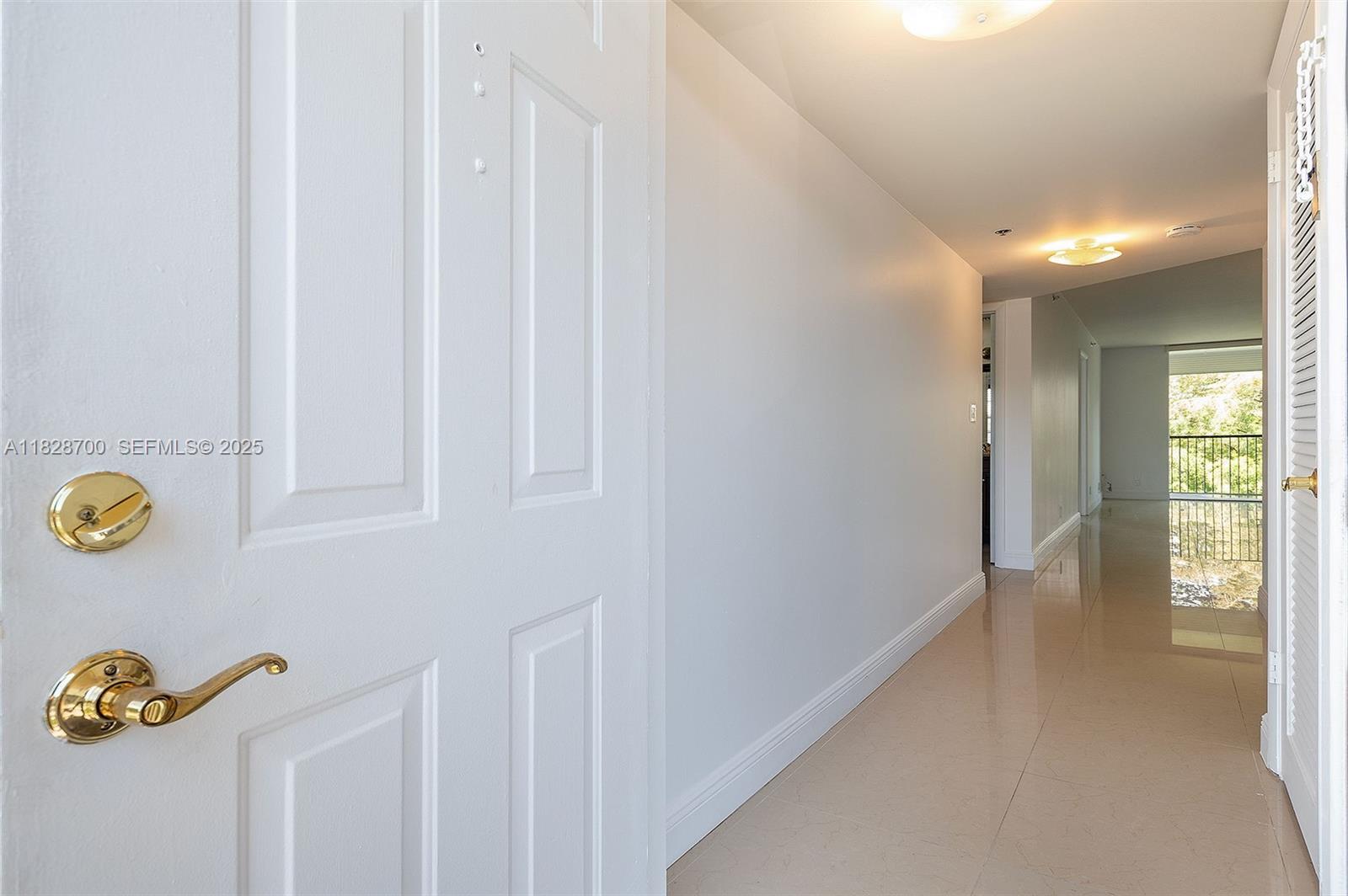 3150 West Rolling Hills Circle, Unit 307 Davie, FL 33328 - Photo 14 of 20 a view of an entryway with wooden floor
