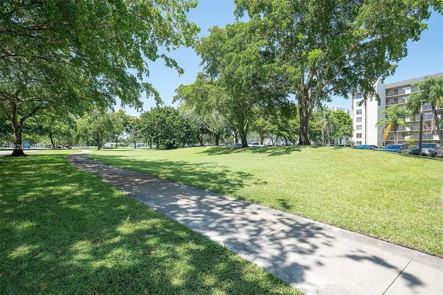 a view of a park with swings and slides