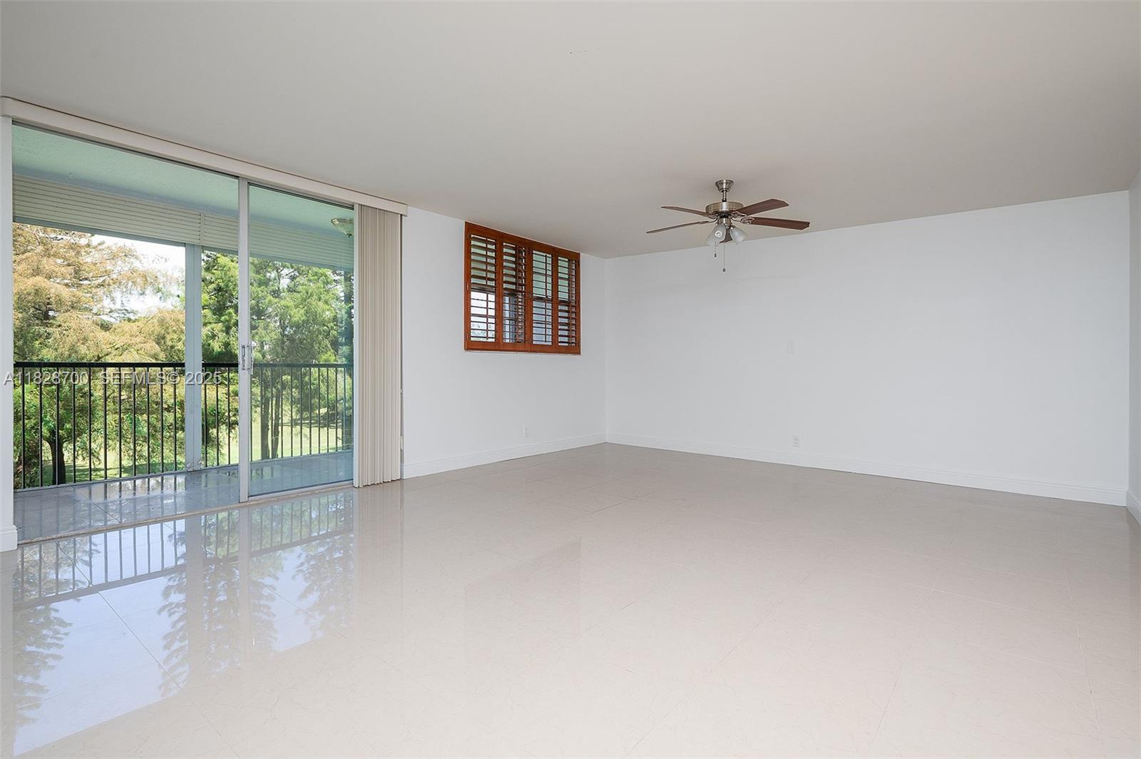 3150 West Rolling Hills Circle, Unit 307 Davie, FL 33328 - Photo 3 of 20 an empty room with a window