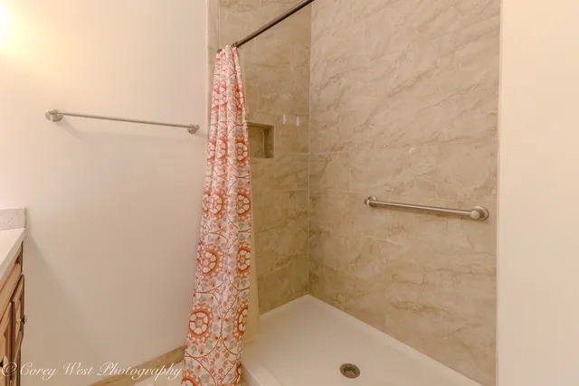 a utility room with a sink and washing machine