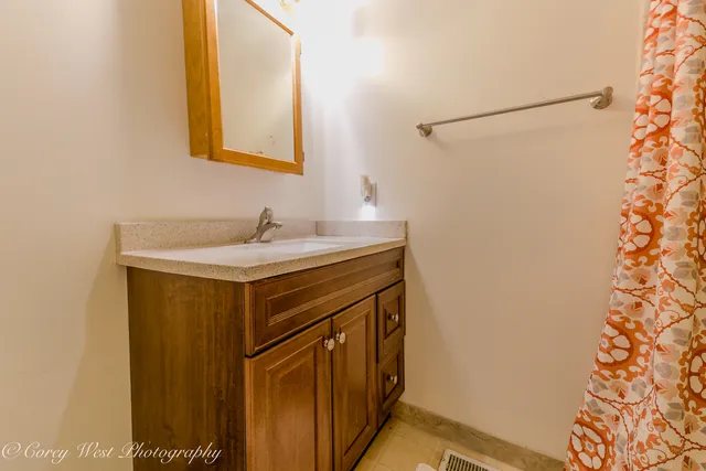 a spacious bedroom with a bed and a window