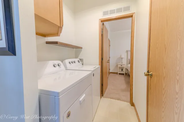 a workspace room with furniture and window