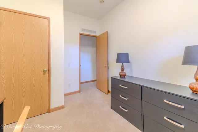 a dining room with furniture and a window