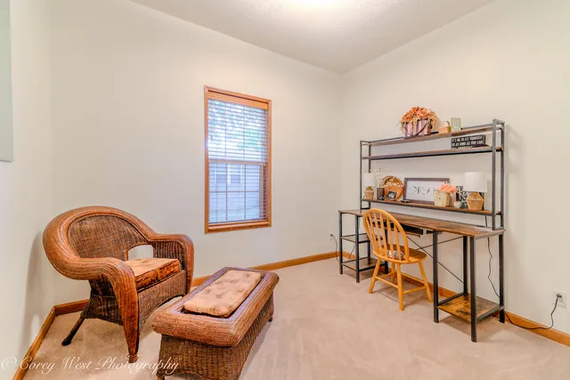 a view of a bathroom with a shower and a window