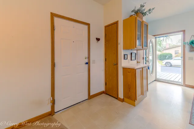 a view of a building with the couches and table and chairs
