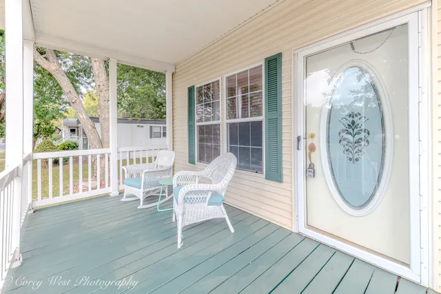 a view of a house with wooden floor and a swing chair