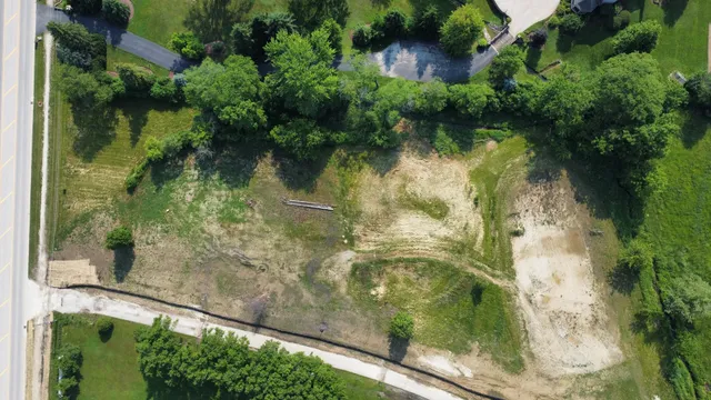 a view of a pathway with a park