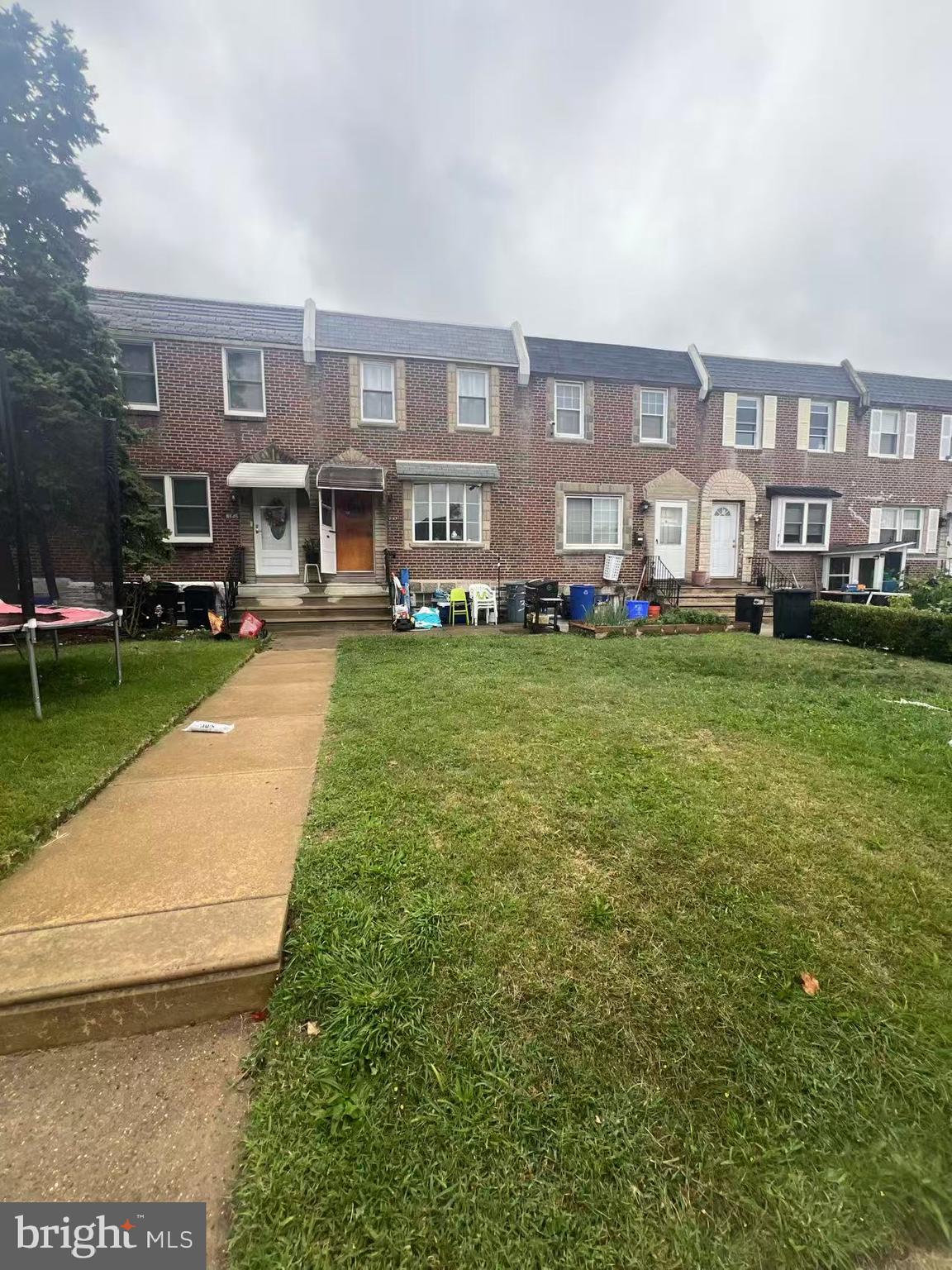 3147 Friendship Street Philadelphia, PA 19149 - Photo 1 of 16 a front view of a house with garden space and swimming pool