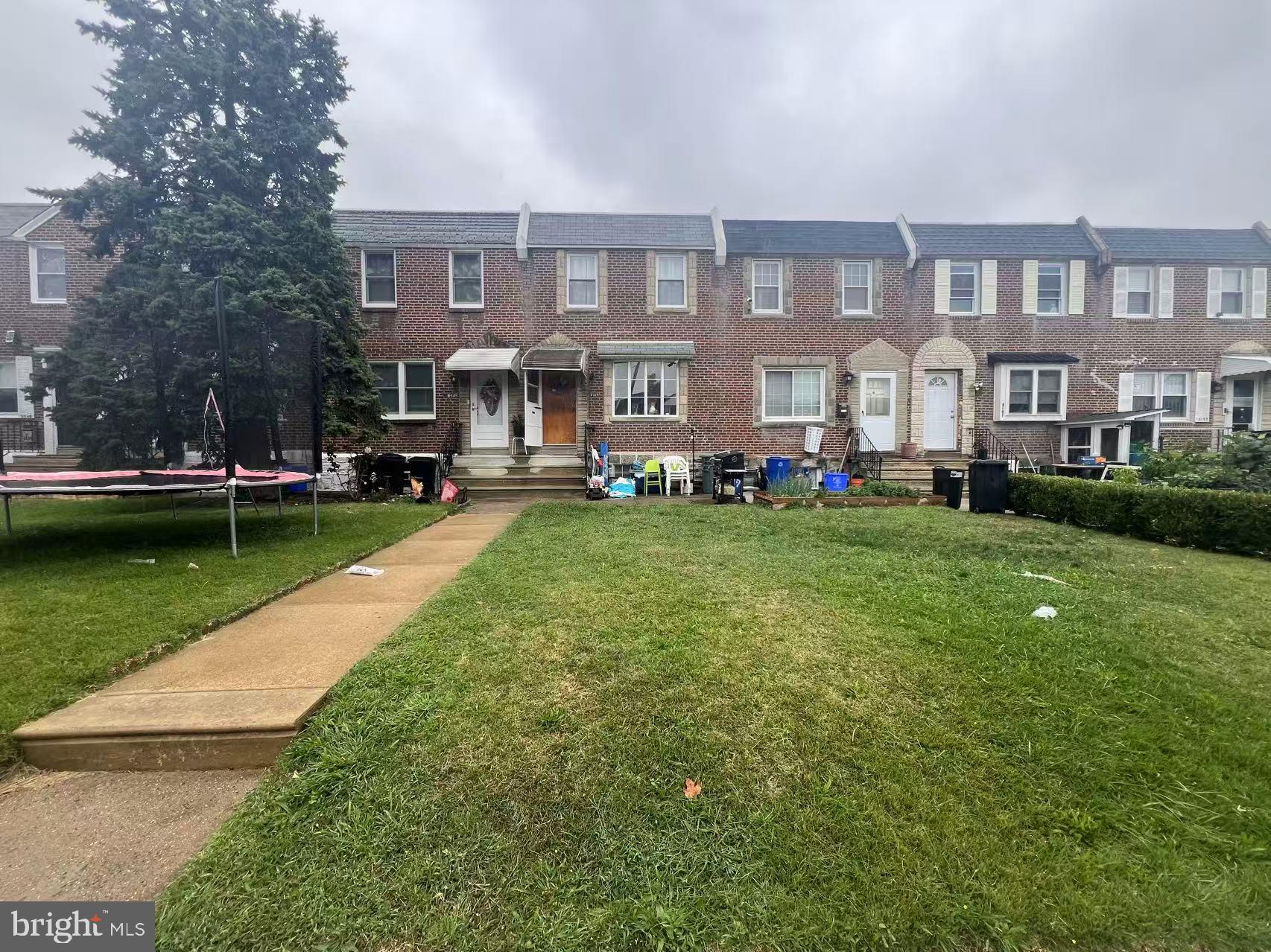 3147 Friendship Street Philadelphia, PA 19149 - Photo 2 of 16 a view of a building with a yard