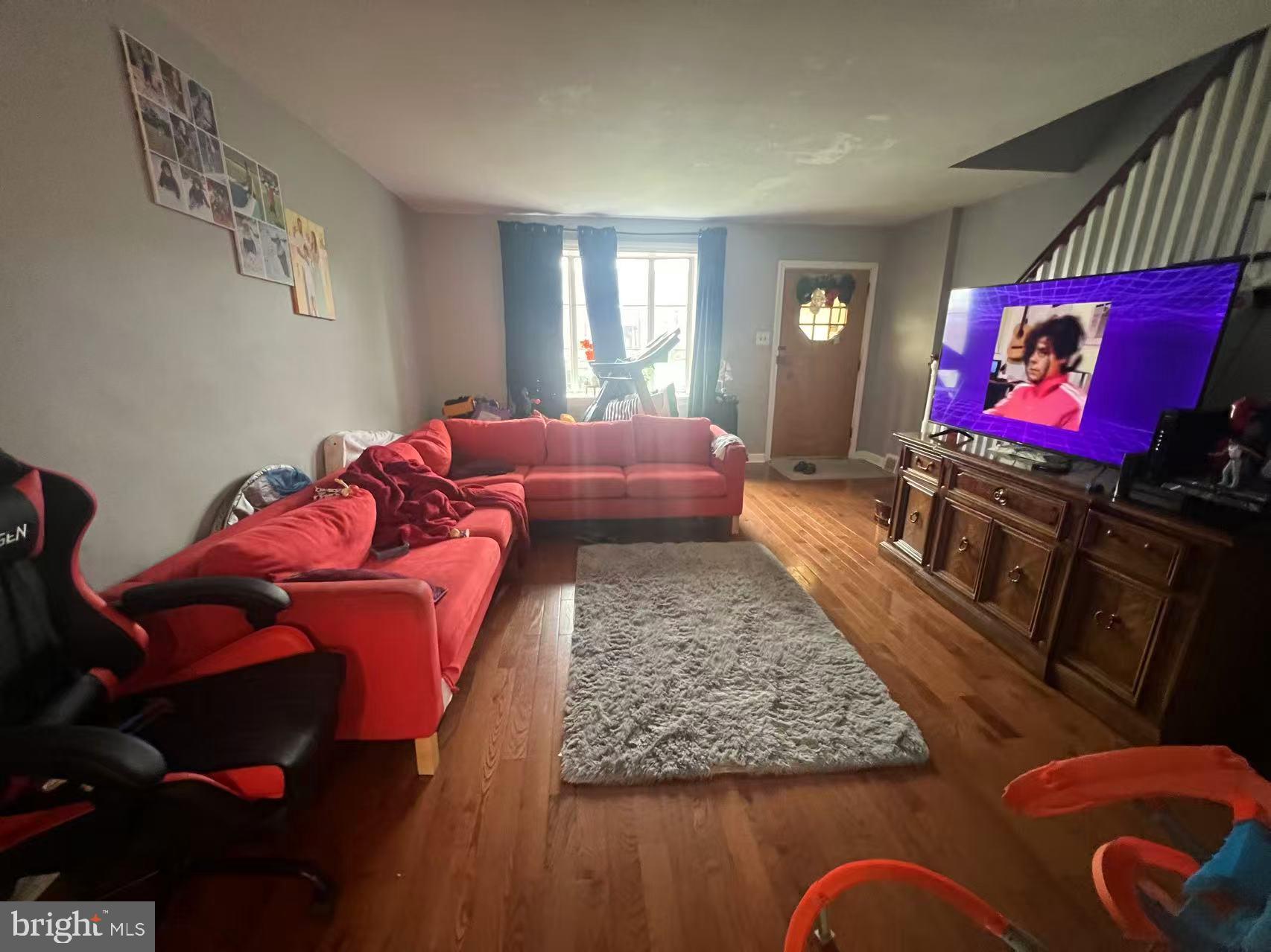 3147 Friendship Street Philadelphia, PA 19149 - Photo 3 of 16 a living room with furniture and a flat screen tv